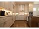 Modern kitchen with stainless steel appliances and a large island at 500 Pearl St, Cumming, GA 30040