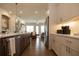 Modern kitchen with stainless steel appliances and a large island at 500 Pearl St, Cumming, GA 30040