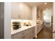 Kitchen features a butlers pantry with wine storage at 500 Pearl St, Cumming, GA 30040