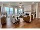 Spacious living room with hardwood floors and a stone fireplace at 500 Pearl St, Cumming, GA 30040