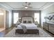 Main bedroom with hardwood floors, tray ceiling and plenty of light at 500 Pearl St, Cumming, GA 30040