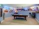 Finished basement area features a pool table surrounded by nostalgic decor at 52 Olivia Ct, Palmetto, GA 30268