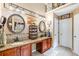 Bathroom showcasing double sinks with dark wood cabinets and granite countertops at 52 Olivia Ct, Palmetto, GA 30268