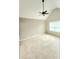 Bright bedroom with a high ceiling, a ceiling fan, and a window, offering ample natural light and ventilation at 52 Olivia Ct, Palmetto, GA 30268