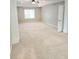 Spacious bedroom with ceiling fan and trim at 52 Olivia Ct, Palmetto, GA 30268