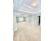 Spacious bedroom featuring tray ceiling and large windows at 52 Olivia Ct, Palmetto, GA 30268