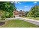 Inviting two-story home with a brick facade, two-car garage, and well-maintained landscaping at 52 Olivia Ct, Palmetto, GA 30268