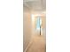 Upstairs hallway featuring carpet flooring and wood trim, creating a warm and inviting transition between rooms at 52 Olivia Ct, Palmetto, GA 30268