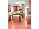 Kitchen featuring wood cabinets, granite countertops, stainless steel appliances, and a convenient center island at 52 Olivia Ct, Palmetto, GA 30268