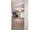 Spacious living room with neutral carpet and modern ceiling fan fixture at 52 Olivia Ct, Palmetto, GA 30268