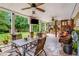 Outdoor patio offers comfortable seating, a mounted TV, and a ceiling fan for relaxing or entertaining at 52 Olivia Ct, Palmetto, GA 30268