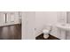 Clean bathroom with pedestal sink and dark floors at 4084 Spencer Trl, Stonecrest, GA 30038