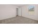 Bright bedroom with window, closet and neutral decor at 4084 Spencer Trl, Stonecrest, GA 30038