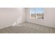 Bright bedroom with a window offering views and neutral decor at 4084 Spencer Trl, Stonecrest, GA 30038