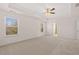 Spacious bedroom with neutral carpet and ceiling fan at 4084 Spencer Trl, Stonecrest, GA 30038