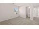 Spacious bedroom with neutral carpet and access to a bathroom at 4084 Spencer Trl, Stonecrest, GA 30038