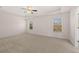 Bright bedroom with neutral carpet and ceiling fan at 4084 Spencer Trl, Stonecrest, GA 30038