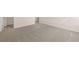 Well-lit bedroom with carpeted floors and access to a hallway at 4084 Spencer Trl, Stonecrest, GA 30038