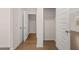 Spacious walk-in closets with wood flooring and ample hanging space at 4084 Spencer Trl, Stonecrest, GA 30038