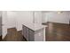 Open concept kitchen with gray cabinets and island at 4084 Spencer Trl, Stonecrest, GA 30038
