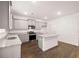 Modern kitchen with gray cabinets and granite countertops at 4084 Spencer Trl, Stonecrest, GA 30038
