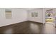Living room with hardwood floors and access to front porch at 4084 Spencer Trl, Stonecrest, GA 30038