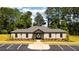 Community pool with clubhouse and landscaping at 4084 Spencer Trl, Stonecrest, GA 30038