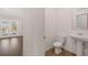 Convenient powder room with pedestal sink and toilet at 4084 Spencer Trl, Stonecrest, GA 30038