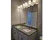 Bathroom vanity with granite countertop, double sinks, and mirror at 6202 Ripple Way # 88, South Fulton, GA 30349