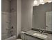 Full bathroom featuring a shower-tub combo with granite counter top at 6202 Ripple Way # 88, South Fulton, GA 30349