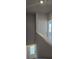 Hallway with access to the basement and view to the second floor at 6202 Ripple Way # 88, South Fulton, GA 30349