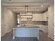 Open concept kitchen featuring granite counters, an island with a sink, and white cabinets at 6202 Ripple Way # 88, South Fulton, GA 30349