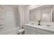 This bathroom has a double vanity, a shower, and marble countertops at 126 Oakchase Park Ln, Hampton, GA 30228
