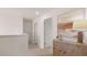 Bright hallway featuring neutral walls, modern trim, and a decorative console table with a table lamp at 126 Oakchase Park Ln, Hampton, GA 30228