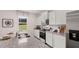 New kitchen features stainless appliances, granite countertops, and gray cabinets at 126 Oakchase Park Ln, Hampton, GA 30228