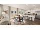 Inviting open-concept living space with stainless steel appliances and granite countertops at 126 Oakchase Park Ln, Hampton, GA 30228