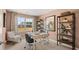 Inviting home office with a large window offering natural light, stylish curtains, and ample shelving at 126 Oakchase Park Ln, Hampton, GA 30228