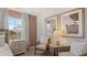 Sitting area next to main bedroom features a comfy chair and artwork at 126 Oakchase Park Ln, Hampton, GA 30228