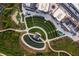 Aerial view of amphitheater, pond and putting greens at the community's main square at 480 Broom Dr, Cumming, GA 30040