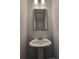 Bathroom featuring a pedestal sink and a framed mirror at 6206 Ripple Way # 89, South Fulton, GA 30349