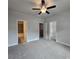 Carpeted bedroom shows ensuite bathroom and walk-in closet at 6206 Ripple Way # 89, South Fulton, GA 30349