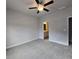 Spacious bedroom with a ceiling fan and carpet flooring at 6206 Ripple Way # 89, South Fulton, GA 30349