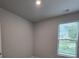 Bright bedroom featuring large window and neutral colored walls at 6206 Ripple Way # 89, South Fulton, GA 30349