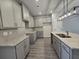Modern kitchen with granite countertops and gray cabinets at 6206 Ripple Way # 89, South Fulton, GA 30349