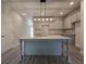 Modern kitchen with a large island, granite countertops, and stainless steel appliances at 6206 Ripple Way # 89, South Fulton, GA 30349