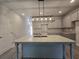 Modern kitchen featuring granite countertops, grey cabinets, and a stylish island at 6206 Ripple Way # 89, South Fulton, GA 30349