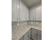 Modern kitchen with grey cabinets and granite countertop at 6206 Ripple Way # 89, South Fulton, GA 30349
