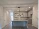 Modern kitchen featuring granite countertops, grey cabinets, and a stylish island at 6206 Ripple Way # 89, South Fulton, GA 30349