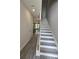Bright foyer with wood-look flooring and a staircase leading to the upper level at 6206 Ripple Way # 89, South Fulton, GA 30349