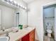 Bright bathroom featuring double sinks, and a door leading to a bathtub/shower combination at 6520 Roswell Rd # 59, Atlanta, GA 30328